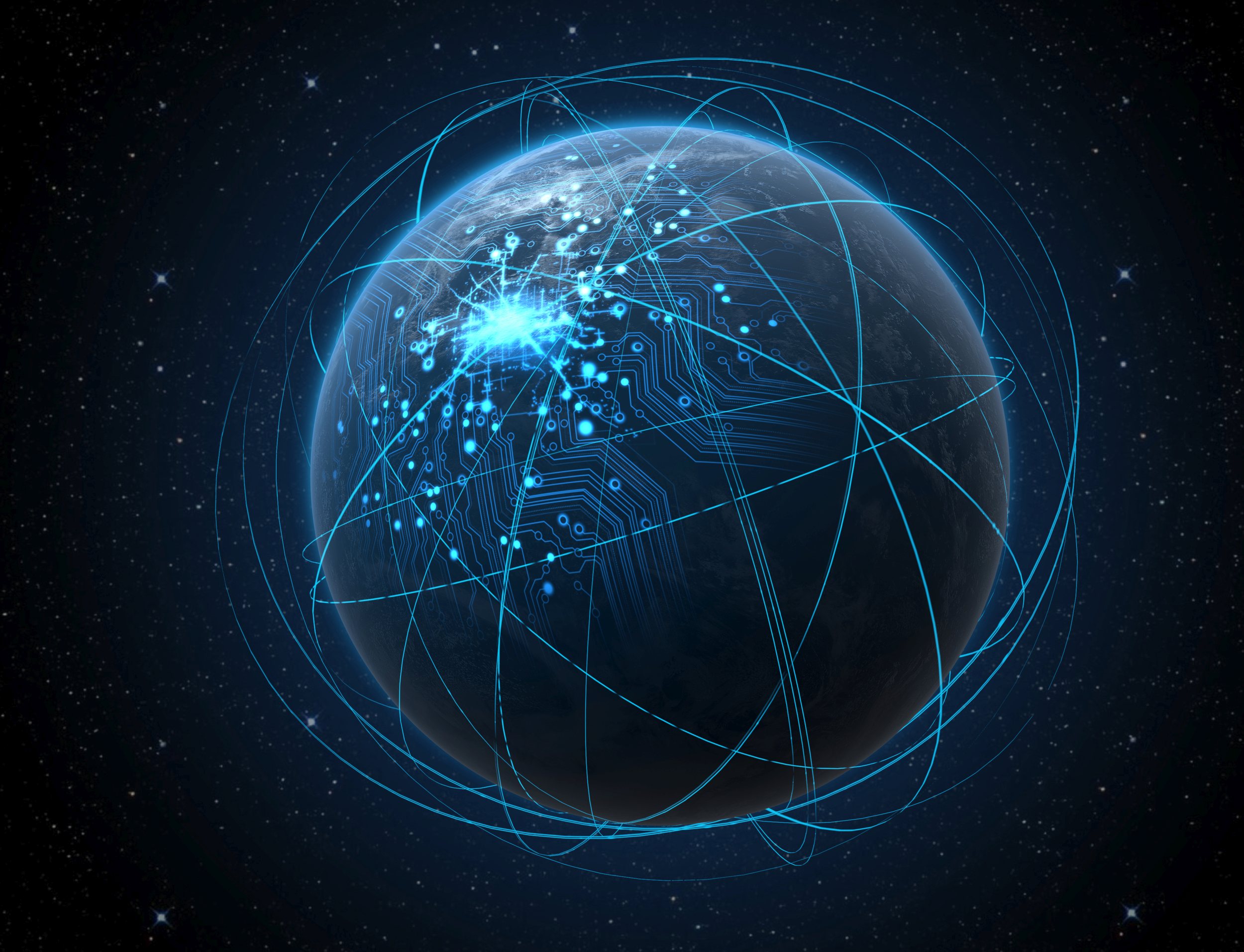 A generic world planet with iluminated city lights and a glowing data circuit network surrounded by orbiting light trails on a dark space background